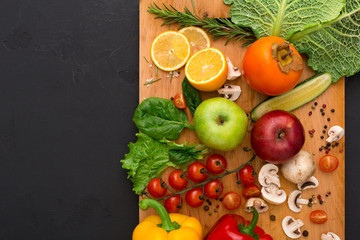 Frame of fresh vegetables on wooden background with copy space