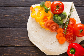 Frame of fresh vegetables on wooden background with copy space