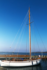 Obraz premium View of Beautiful White Yacht. Daylight. Sea Background.