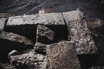 A photo of hole in the crack cement concrete wall surface texture, the conceptual background, closeup