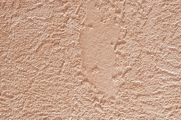 Rough abstract scratched beige-brown wall texture