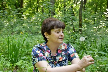 A woman with a dandelion