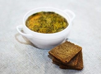 Vegetable Soup and Bread on a Table.