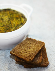 Vegetable Soup and Bread on a Table.