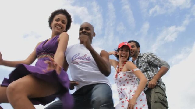 Cuban people dance outside, low angle