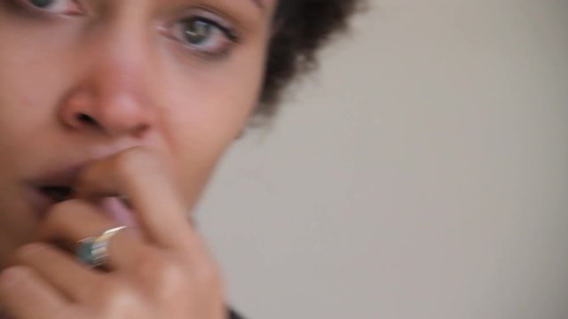 Close up, woman holds back tears