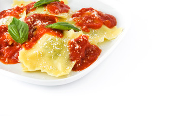 Ravioli with tomato sauce and basil isolated on white background
