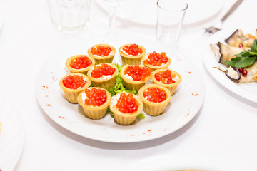 Tartlets with red caviar. Protein healthy food
