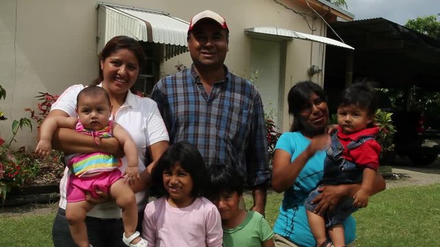 Mexican family outside home, close up