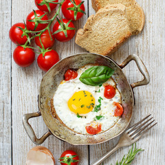 Fried egg on an old frying pan
