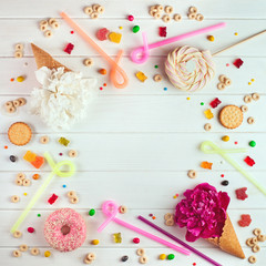 Birthday party background with candies, flower ice cream and biscuits