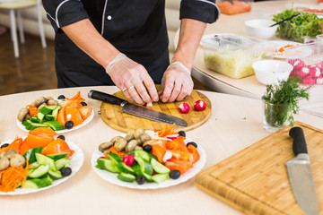 Close-up of chef cooking food kitchen restaurant cutting cook hands hotel man male knife preparation fresh preparing concept