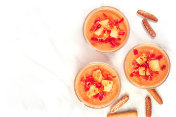 Salmorejo in glasses with breadsticks, and copy space