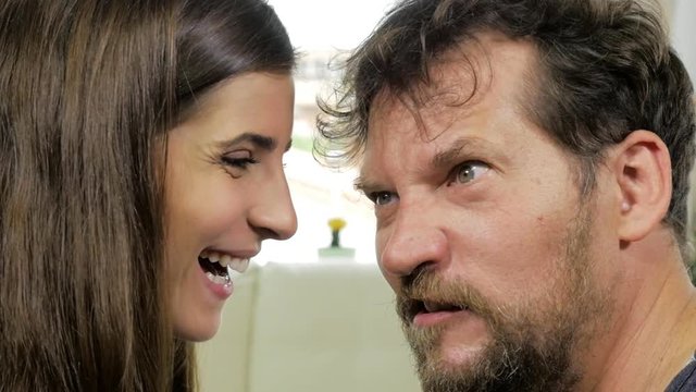 Funny couple making crazy faces looking camera attacking wild slow motion
