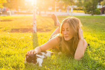 Cute Cat and Woman playing with him Outdoor Lifestyle, Friendship and Pet Owner concept
