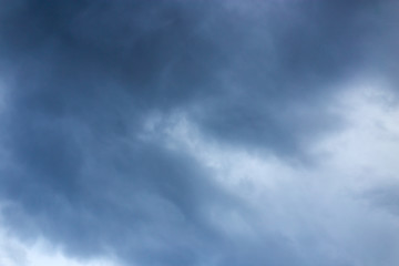 Beautiful clouds at sunset after rain as background .