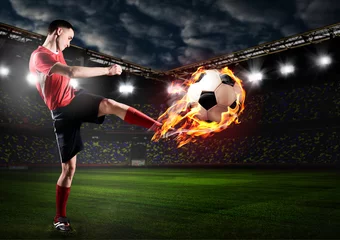 Keuken spatwand met foto soccer or football player is kicking ball on stadium © Sergey Peterman