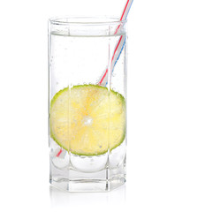 Fototapeta na wymiar Glass with water and a lime slice.