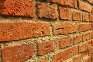 Wall of red brick. Fragment of the wall of the building built in 1937