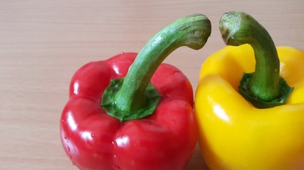 Bell peppers, isolated on the wooden table.