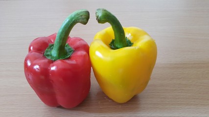 Bell peppers, isolated on the wooden table.