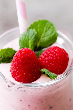 Raspberry milk shake with mint decor.
