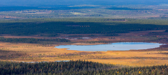 Autumn landscape with lake in Lapland, view from mountain, Finland