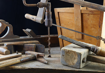 old carpenter handworking tools on a workbench