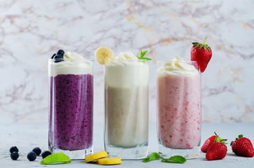 set of milkshakes: banana, strawberry and blueberry