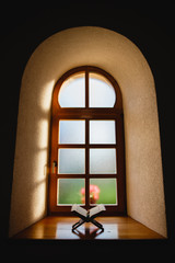 Quran in front of amazing wooden window