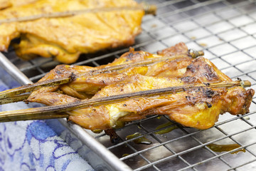 Roast chicken wings on grill, Roast pork on grill.