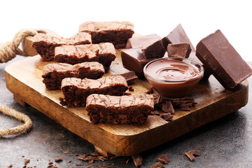 Brownie stack, chocolate cake on rustic wooden board