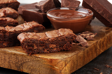 Brownie stack, chocolate cake on rustic wooden board