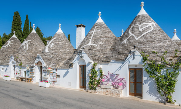Fototapeta Scenic sight in Alberobello, the famous Trulli village in Apulia, southern Italy.