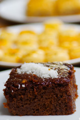 Delicious chocolate cake on plate with a blurred background