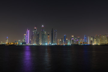 Dubai Marina night skyline from Palm Jumeirah promenade, UAE United Arab Emirates