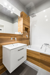 Bathroom with bathtub and mirror