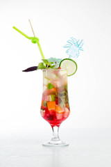 Glass of red ice tea with mint and lemon isolated