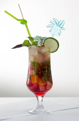 Glass of red ice tea with mint and lemon isolated