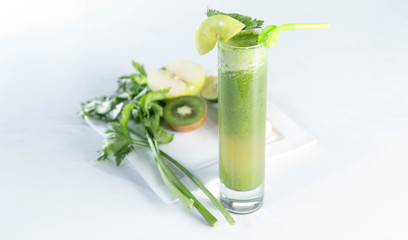 Healthy and fresh kiwi smoothie in glass on isolated white backhround