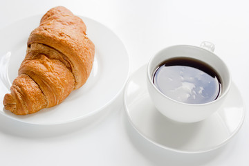 coffee and croissant for breakfast of businessman white office desk background