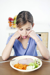 Obraz na płótnie Canvas Child eating a meal
