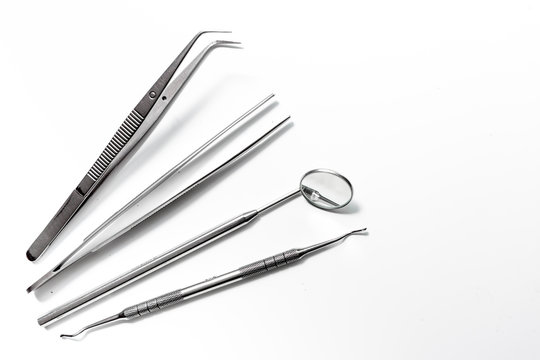 dentistry with dentist tools close up on white background top view space for text