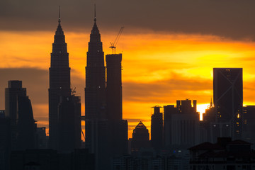 Fototapeta na wymiar A majestic sunset in Kuala Lumpur, the capital of Malaysia. Its modern skyline is dominated by the 451m tall KLCC, a pair of glass and steel clad skyscrapers.
