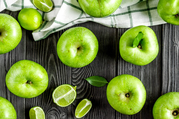 Organic fruits with green apples pattern on dark background top view