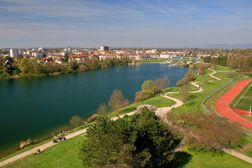 Aerial view of Freiburg Seepark which is a beautiful lake within the inofficial capital of Black Forest, Germany