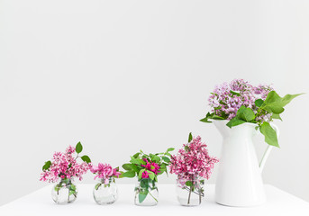 Vases with pink and purple spring flowers