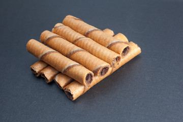 Chocolate sticks on black background
