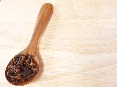 clove on teak wood spoon