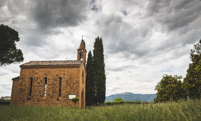 Fototapeta na wymiar Small brick countryside church